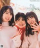 A group of three young women posing for a picture.